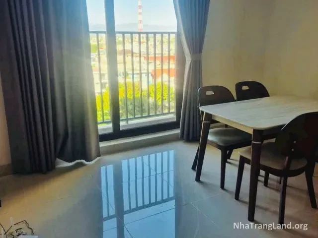 Phòng khách có cửa ra ban công và bàn ăn của căn hộ CT3 Vĩnh Điềm Trung — ảnh 2