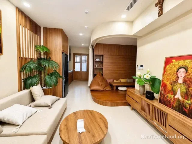Phòng khách sofa và kệ tivi gỗ của căn hộ CT1 Riverside Luxury